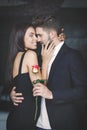 Young rich couple with rose dating Royalty Free Stock Photo