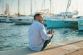 Young rich man at Yacht Club. Businessman is Relaxing