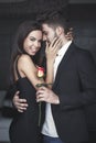 Young rich romantic couple with rose on dating Royalty Free Stock Photo