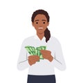 Young rich woman holding dollar bills in hands excited with win or promotion. Happy female count money joyful with income or Royalty Free Stock Photo