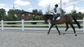 Young rider canter at the arena