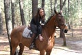 Young rider in forest