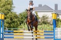 Teen girl jumping horse on her show jumping course Royalty Free Stock Photo