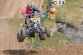 Young rider in high jump on a quad bike