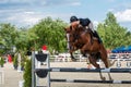 Young rider on horse show, jumping competition, trained horse for Equitation sport competition