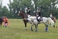 Young rider show jumping in the warm