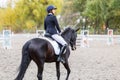 Young rider woman on horse on dressage competition Royalty Free Stock Photo