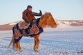 Young riders rider does acrobatics on his horse