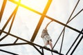 Young risky man balancing on the top of high metal bridge Royalty Free Stock Photo