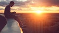 Young risky man chilling above the city with smartphone at sunset Royalty Free Stock Photo
