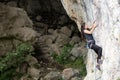 Young rock climber climbing hard and steep tufa line on top-rope Royalty Free Stock Photo