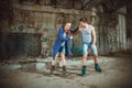 Young roller couple on graffiti background Royalty Free Stock Photo