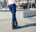 Young Roller Girl is learning how to skate