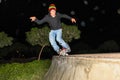 A young roller practicing tricks on the skating rinks