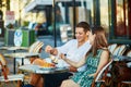 Young romantic couple in a cozy outdoor cafe in Paris, France Royalty Free Stock Photo