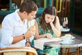 Young romantic couple in a cozy outdoor cafe in Paris, France Royalty Free Stock Photo