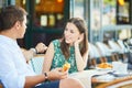 Young romantic couple in a cozy outdoor cafe in Paris, France Royalty Free Stock Photo