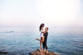 Romantic couple dancing ans smiling at sunset. Royalty Free Stock Photo