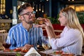 Young romantic couple at dinner in fancy restaurant. Royalty Free Stock Photo