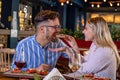 Young romantic couple at dinner in a fancy restaurant. Royalty Free Stock Photo