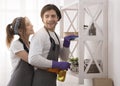 Young Romantic Couple Doing Housework At Home Together, Hugging And Smiling Royalty Free Stock Photo