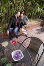 Young romantic couple having drinks on patio Royalty Free Stock Photo