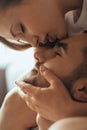 Close-up of young romantic couple is kissing and enjoying the company of each other at home Royalty Free Stock Photo