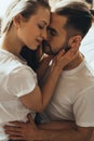 Young romantic couple is kissing and enjoying the company of each other at home Royalty Free Stock Photo