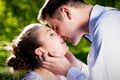 Young romantic couple kissing with love in summer park. Royalty Free Stock Photo