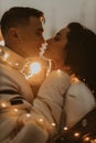 Young romantic couple in love outdoors in winter before Christmas. Two lovers are hugging and kissing in Saint Valentine`s Day. Royalty Free Stock Photo
