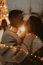 Young romantic couple in love outdoors in winter before Christmas. Two lovers are hugging and kissing in Saint Valentine`s Day. Royalty Free Stock Photo