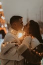 Young romantic couple in love outdoors in winter before Christmas. Two lovers are hugging and kissing in Saint Valentine`s Day. Royalty Free Stock Photo