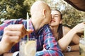 Young romantic couple in love spend time in the park, sits in a summer cafe and drinking cold lemonade. Young man Royalty Free Stock Photo