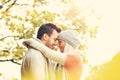 Young romantic couple in the park in autumn Royalty Free Stock Photo