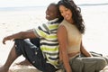 Young Romantic Couple Relaxing On Beach Together