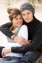 Young Romantic Couple Relaxing On Beach Together