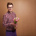 A young romantic man holding a bouquet Royalty Free Stock Photo