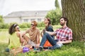 Young romantic people having rest in park