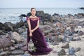 Young romantic woman posing on the beach watching the sunset Royalty Free Stock Photo