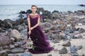 Young romantic woman posing on the beach watching the sunset Royalty Free Stock Photo