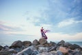 Young romantic woman posing on the beach watching the sunset Royalty Free Stock Photo