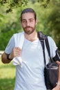 young runner taking breath after running in park Royalty Free Stock Photo