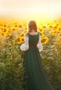 Young rural woman peasant back rear view. Bavarian beauty green dress vintage medieval national costume. Hairstyle