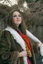 Young russian woman in a fur coat