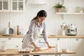 Young 35s Hispanic woman prepare pastries in the kitchen