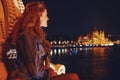 Young 20s woman wondering in Budapest night panorama Royalty Free Stock Photo