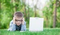 Young sad boy with laptop computer Royalty Free Stock Photo