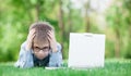 Young sad boy with laptop computer Royalty Free Stock Photo