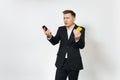 Young successful handsome rich business man in black suit on white background for advertising.