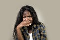 Young sad and depressed black African American woman crying anxious and overwhelmed feeling sick and stressed isolated on studio b Royalty Free Stock Photo